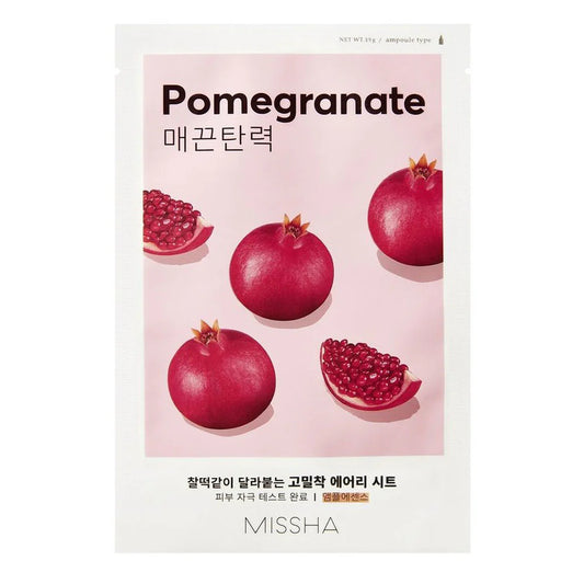 Pomegranate-themed product packaging with pomegranates on a pink background, featuring the brand 'Missha'.